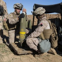 Marines preparing 155 mm round